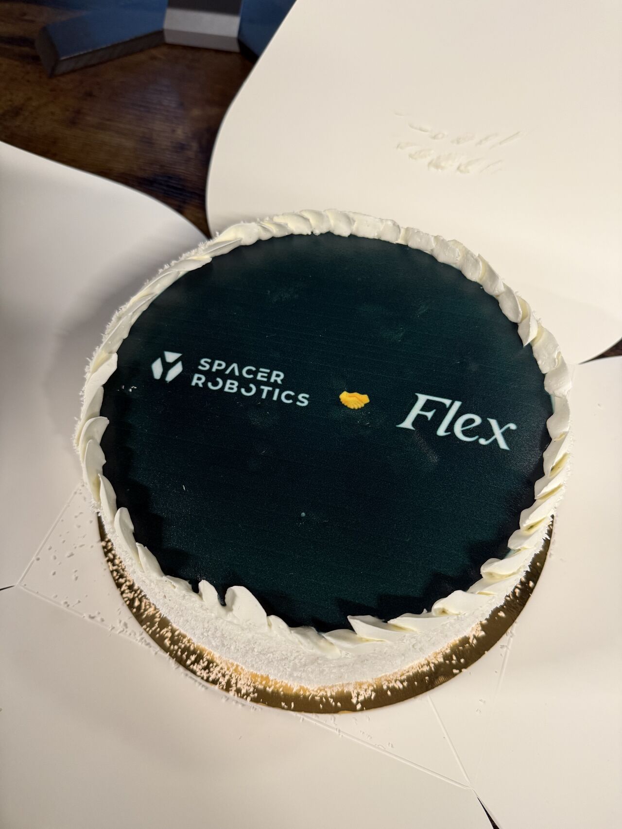 A custom robotics-themed coldcake ready for hand delivery