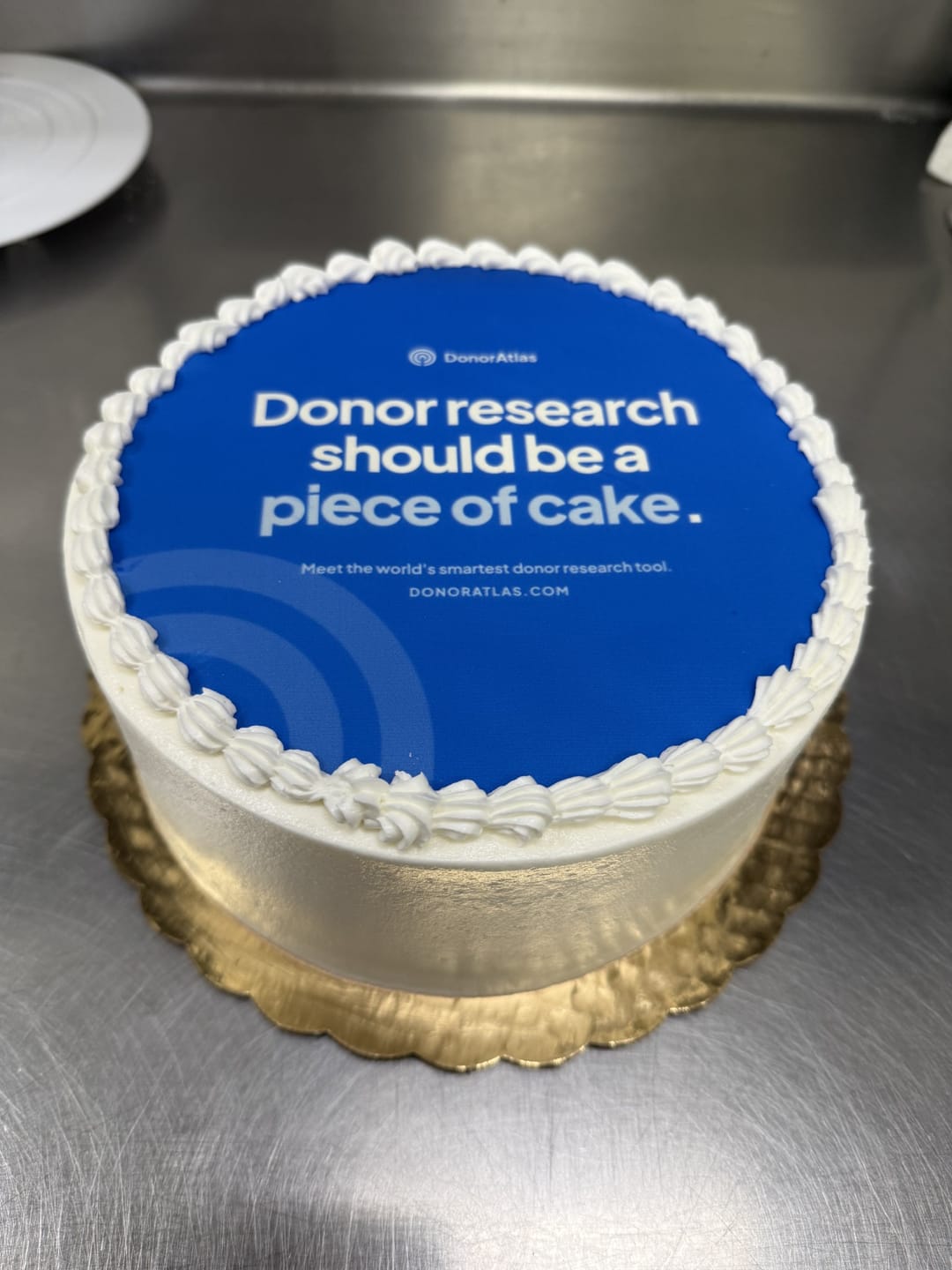 A blue cake printed with Donor research should be a piece of cake